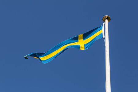 Photograph of a long and thin Swedish flag.の写真素材