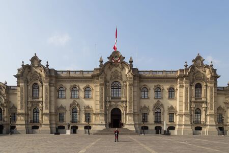 Lima, Peru - September 5, 2015: The Government Palace in the city centre with guards standing in front of it.のeditorial素材