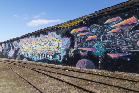 Copenhagen, Denmark - March 17, 2016: Graffiti mural in abandoned industrial district.のeditorial素材