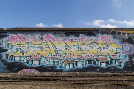 Copenhagen, Denmark - March 17, 2016: Graffiti mural in abandoned industrial district.のeditorial素材