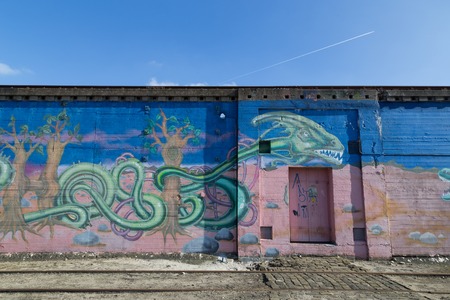 Copenhagen, Denmark - March 17, 2016: Graffiti mural in abandoned industrial district.のeditorial素材