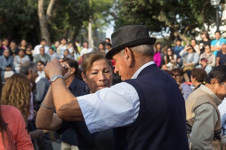 Lima, Peru - August 29, 2015: People at the public Saturday Salsa dancing event in Parque Kennedy in Miraflores district.のeditorial素材