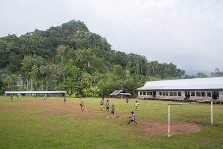 Chumbikopi, Solomon Islands - June 10, 2015: Kids playing soccer in Chumbikopi villageのeditorial素材