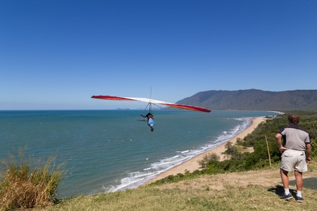 Port Douglas, Australia - April 27, 2015: Hang glider starting from from Trinity Bay lookout.のeditorial素材