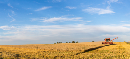 Ramlose, Denmark - August 24, 2016: Panoramic view of a combine harvester at workのeditorial素材