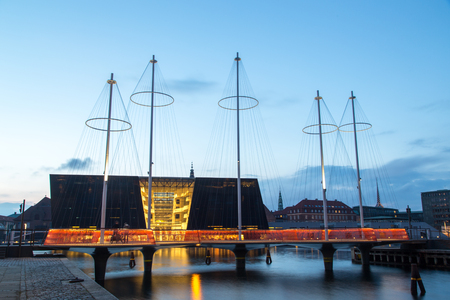 Copenhagen, Denmark - April 27, 2016: Nightshot of the modern Circle Bridge with the Royal Library behindのeditorial素材