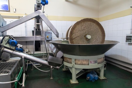 Mendoza, Argentina - November 23, 2015: A grinding stone inside an olive oil factoryのeditorial素材
