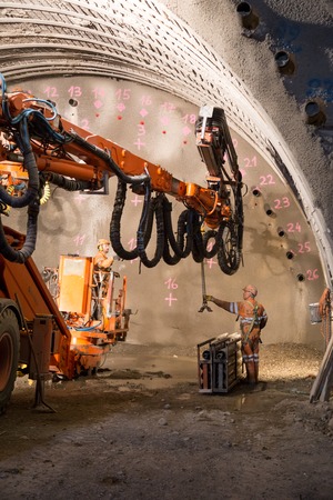Geneva, Switzerland - May 22, 2014: Two workers preparing the machine for the construction of piperoof grouting for a tunnelのeditorial素材