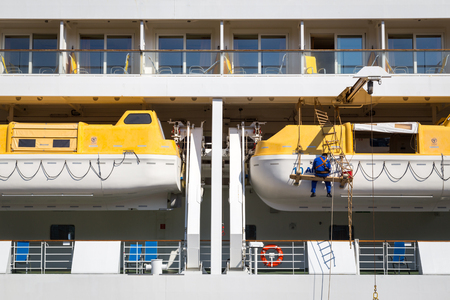 Copenhagen, Denmark - May 02, 2016: Man working on lifeboat of the Cruise ship AIDAluna.のeditorial素材