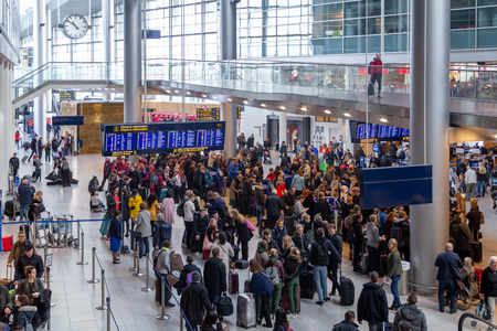 Copenhagen, Denmark - March 9, 2019:  Group of people inside the terminal at Copenhagen Airport.のeditorial素材