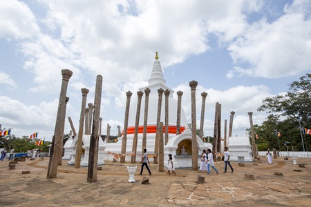 Anuradhapura, Sri Lanka - August 21, 2018: People at the ancient Buddhist Temple Thuparamaya, the earliest Dagoba to be constructed in Sri Lanka.のeditorial素材