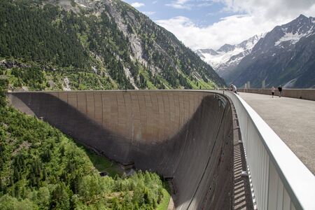 Finkenberg, Austria - June 9, 2018: People on top of the Schlegeis Dam in the Zillertal valley.のeditorial素材