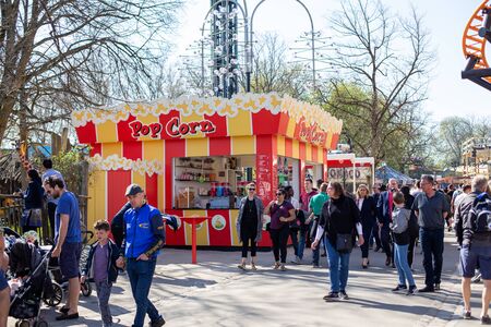 Copenhagen, Denmark - April 21, 2019: A popcorn shop and people in Bakken, the oldest amusement park in the world.のeditorial素材