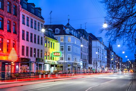 Copenhagen, Denmark - April 5, 2017: Long exposure photography of the illuminated street Norrebrogade in Norrebro district by night.のeditorial素材