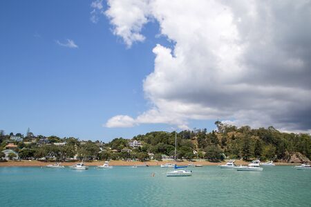 Russell, New Zealand - February 18, 2015:  Sailboats anchored in Russell harbour.