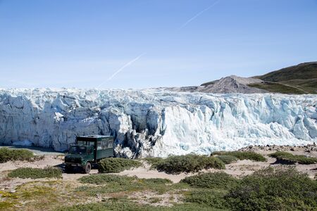 Kangerlussuaq, Greenland - July 13, 2018: A tour jeep standing in front of Russell Glacier.のeditorial素材
