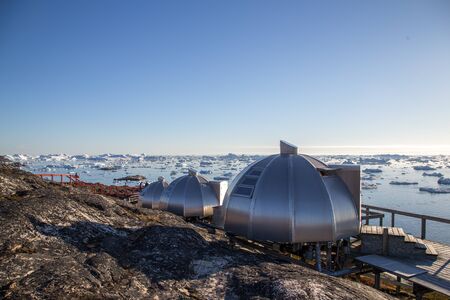 Ilulissat, Greenland - July 3, 2018: The igloos at Hotel Arctic with view over the Icefjord.のeditorial素材