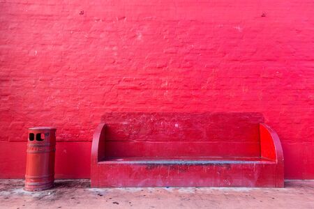 Copenhagen, Denmark - January 14, 2017: Red wall, red bench and red trash bin on the Red Square in Superkilen Park in Norrebro district.の写真素材