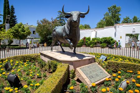 Ronda, Spain - May 31, 2019: Bull statue infront of the bullring in the historic city centre.のeditorial素材