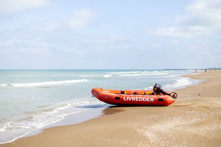 Lokken, Denmark - July 18, 2019: A lifeguard rubber boat at the sand beach in Lokken in Northern Jutland.のeditorial素材