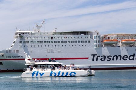Malaga, Spain - May 24, 2019: A tourist yacht sailing in the harbour.のeditorial素材