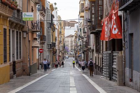 Malaga, Spain - May 24, 2019: People in the charming streets in the historic city centre.のeditorial素材