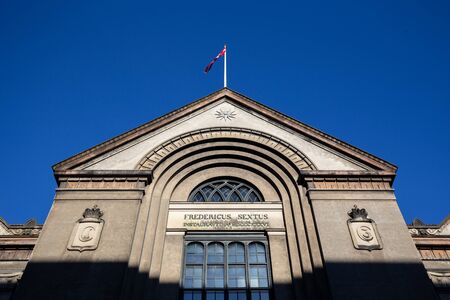 Copenhagen, Denmark - February 22, 2019: Low angel view of the facade of the University of...