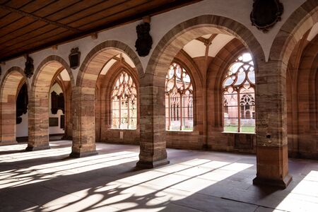 Basel, Switzerland - March 10, 2019: The cloister at the Basel Minster. The Basel Minster is one of...