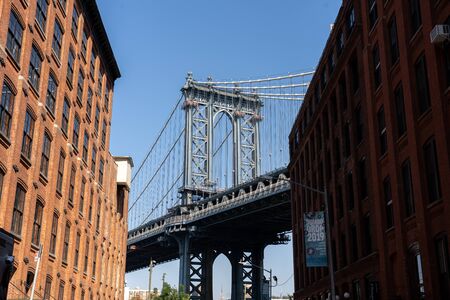 New York, United States of America - September 22, 2019: Pillar of Manhattan Bridge as seen from an alley in Dumbo district in Brooklyn.のeditorial素材