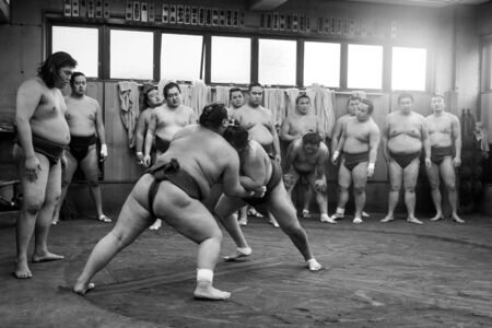 Tokyo, Japan - December 21, 2014: Japanese sumo wrestler training in their stall in Ryogoku district.のeditorial素材