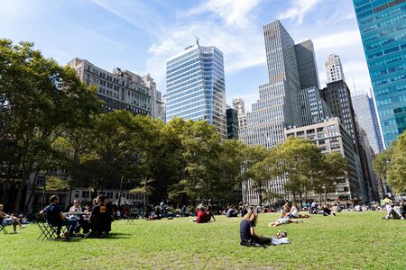 New York, United States of America - September 20, 2019: People on the grass lawn in Bryant Park in...