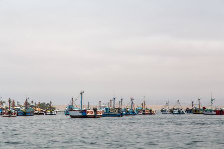 Paracas, Peru - September 12, 2015: Pelicans sitting on a fishing boat anchored in the bayのeditorial素材