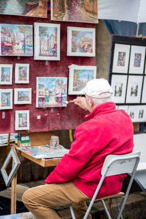 Paris, France - May 12, 2017: An artist painting on Place du Tertre in Montmartre districtのeditorial素材