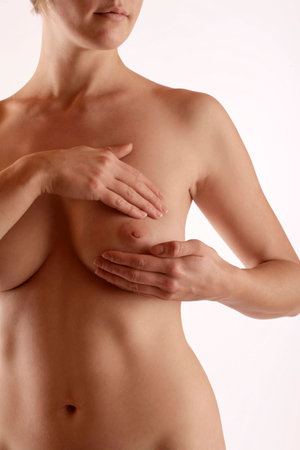 Young woman scans her breast for Cancerの写真素材