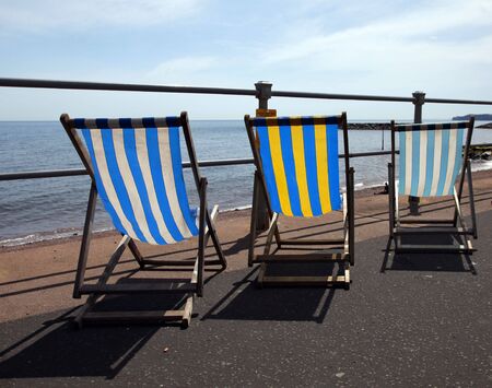 Deck chairs along sidmouth sea frontの写真素材