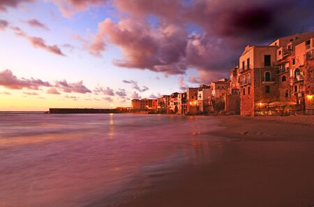 Sunset over cefalu beachの写真素材