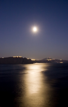 Moonlight over santorini calderaの写真素材