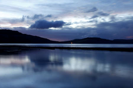 Twilight on the beach at Lyme Regisの写真素材