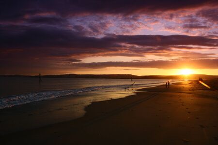 On the beach in Devon at sutset の写真素材