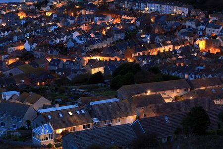Terraced houses at night time on portland dorsetの写真素材