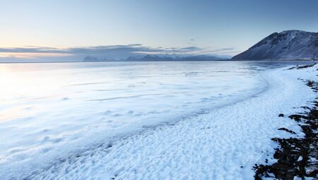 Iceland sunset and Ice shapes in the east fjords iceland at sunset in winterの写真素材