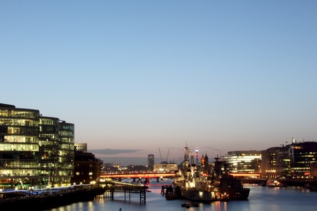 Contemporary London Architecture & Battleships along the Thames River bank UKのeditorial素材