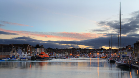 Sunset over Weymouth Quayside Early Autumnの写真素材