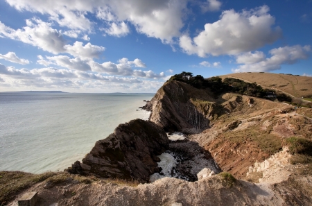 Idilic Lulworth Cove famouse UK landmark coastlineの写真素材