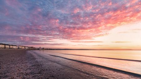 Spring sunrise taken from Weymouth beach Dorsetの写真素材