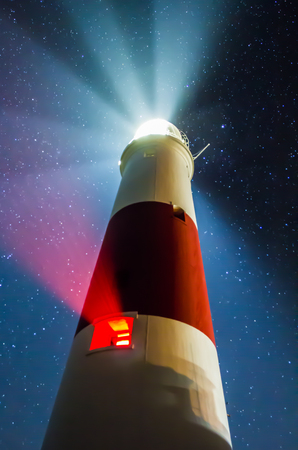 The Night Stars Over Portland Bill Light House in Dorsetの写真素材