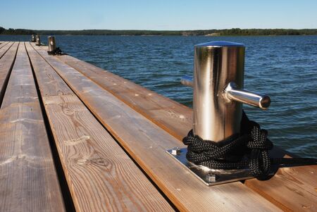 shining metal knight on the wooden berth                                    の写真素材