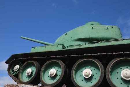 old green armored tank against blue sky                                    の写真素材
