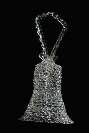 crystal decoration bell against black background verticalの写真素材