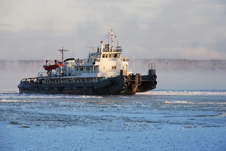 icing tugboat in winter after the stormの写真素材